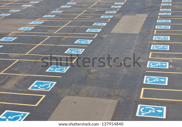 Parking spaces reserved for the handicapped in
outdoor parking lot.