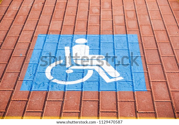 Parking symbol for the disabled in the car park\
Selective Focus 
