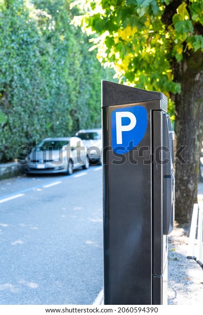 Parking\
ticket purchase machine on the sidewalk in\
Italy
