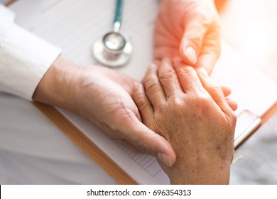Parkinson and alzheimer female senior elderly patient with physician doctor in hospice care.