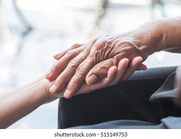 Parkinson disease patient, Alzheimer elderly senior, Arthritis person's hand in support of nursing family caregiver care for disability awareness day, National care givers month, aging society concept