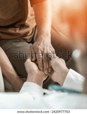 Parkinson disease patient, Alzheimer elderly senior, Arthritis person's hand in support of geriatric doctor or nursing caregiver, for disability awareness day, ageing society care service Stockfoto © 