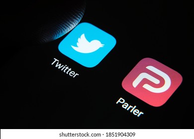 Parler Twitter apps and finger tip above it. Parler is far right social network. Parler is a social media banned from Google Play and App Store. Concept. Stafford, UK, November 10 2020