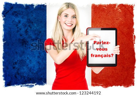 Parlez-vous francais? young woman holding tablet pc on the background with french national flag. french language learning concept