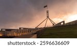 Parliament House, Canberra, Australia during sunset with thick clouds
