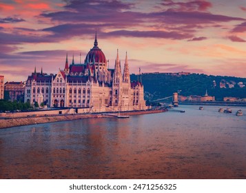 Parliament house on the shore of Dunabe river. Stunning summer cityscape of Budapest. Colorful sunset in Hungary, Europe. Traveling concept background. - Powered by Shutterstock