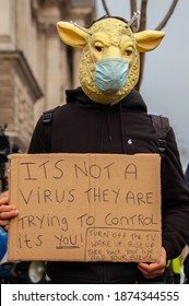 PARLIAMENT SQUARE, LONDON, ENGLAND- 14 December 2020: Protester Wearing A Sheep And Surgical Mask At An Anti-lockdown Protest Organised By The National Alliance For Freedom From Lockdowns