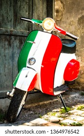 Parma, Italy - April 27: typical old Vespa small motorbike at the old town on April 27, 2018 in Parma, Italy