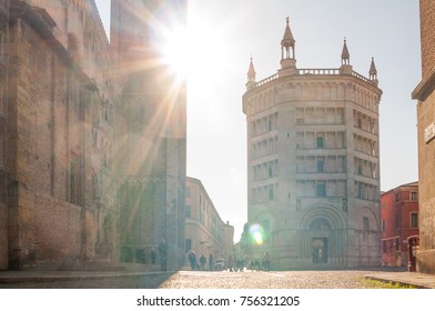 PARMA, ITALY - NOVEMBER, 2017:  View Of Baptistery Of Parma In Duomo Square (Piazza Duomo) With Sun Flares And Tourists. Parma Is Italian Capital Of Culture 2020.