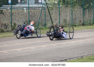 Parma, Italy - October 2020: Couple Of Disabled Athlete Training With Their Hand Bikes On A Track.