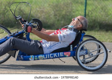 Parma, Italy - October 2020: Senior Athlete Training With His Special Bike On A Track.