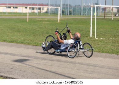 Parma, Italy - October 2020: Senior Athlete Training With His Hand Bike On A Track.