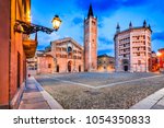 Parma, Italy - Piazza del Duomo with the Cathedral and Baptistery, built in 1059. Romanesque architecture in Emilia-Romagna.