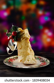 Parmesan Cheese With Christmas Decoration, On A Christmas Plate And Colored Lights In The Background