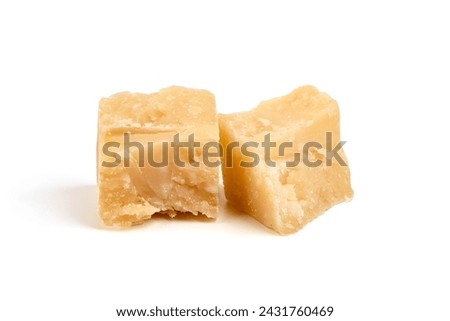 Parmesan cheese chunks, hard cheese, isolated on white background.