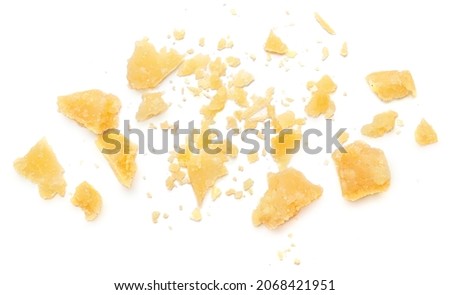 Parmesan cheese  crumbs (Parmigiano, Grana)  isolated on white background.  Flat lay, top view.
