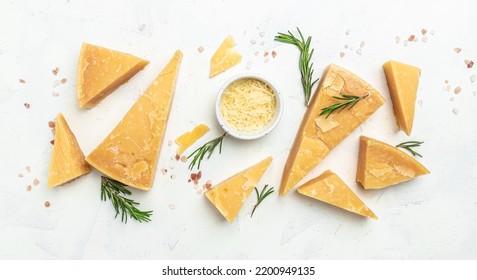 Parmesan cheese, Hard cheese, rosemary on a light background. Long banner format. top view. - Shutterstock ID 2200949135