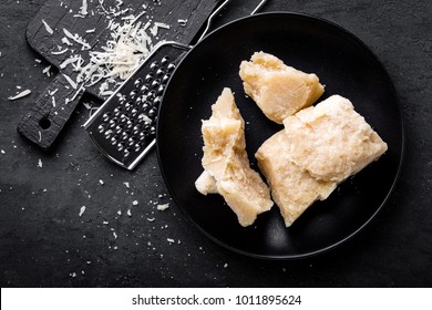 Parmesan Cheese On Black Background