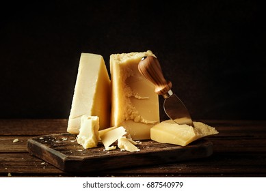 Parmesan cheese on wooden board.  Vintage view. - Powered by Shutterstock