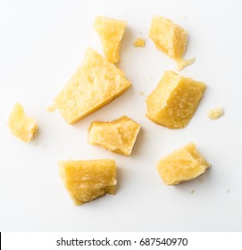 Parmesan Cheese Pieces On White Background. Top View.