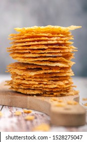 Parmesan chips. Appetizer for a gluten-free and ketogenic diet. Close up and vertical orientation. 