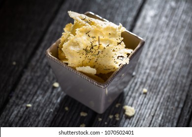 Parmesan Chips On Wood Background