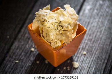 Parmesan Chips On Wood Background