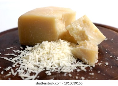 Parmesan. Piece Of Cheese On White Background. Shredded Parmesan Cheese