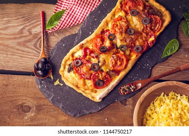 Parmesan Salami Long Pizza On Wooden Board. Pepperoni And Peppers Over Cheese Pizza 