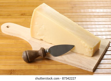 Parmesan Slices On Cutting Board