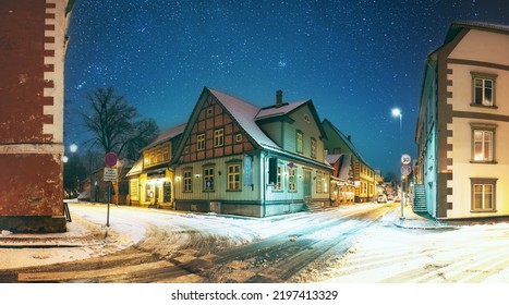 Parnu, Estonia. Night View Of Kuninga Street With Old Buildings, Wooden Houses, Restaurants, Cafe, Hotels And Shops In Winter Evening Night Illuminations.Altered starry night sky stars. - Shutterstock ID 2197413329