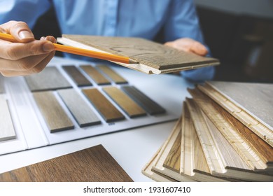 parquet floor. seller showing cross section of flooring sample layers - Shutterstock ID 1931607410