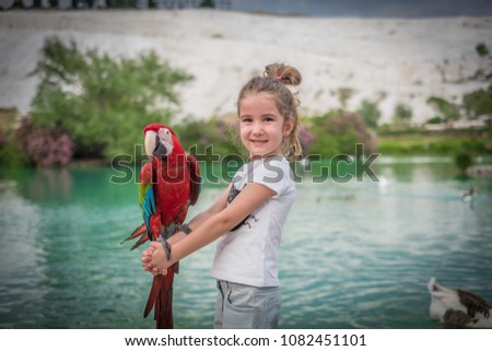 parrot on the kid girl