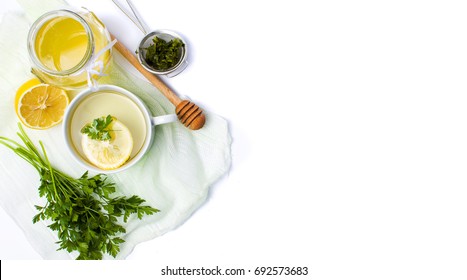 Parsley Tea With Lemon And Honey On White