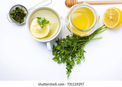 Parsley Tea With Lemon And Honey On White