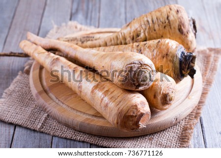 Parsnips on a wooden cutting board