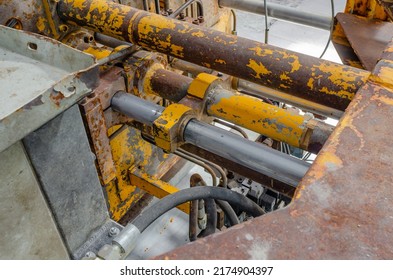 Part Of Abandoned Rusty Machine. Old Industrial Equipment. Pipes, Hoses.