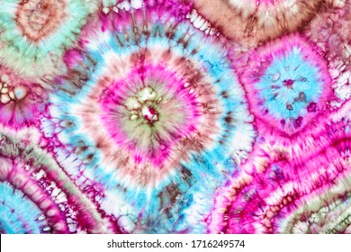 part of abstract bright ornament in tie-dye batik technique handpainted on silk head scarf - Powered by Shutterstock