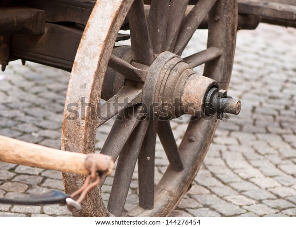 Part of ancient cart\
with wooden wheels