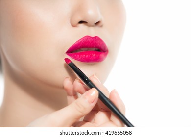 Part Of Attractive Asian Woman's Face With Fashion Red Lips Makeup. Make-up Artist Apply Pink Lipstick