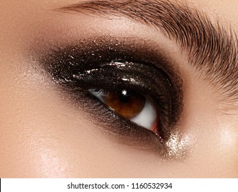 Part Of Beauty Face. Close Up Of Blue Woman Eye With Beautiful Brown With Shades Smokey Eyes Makeup. Modern Fashion Make Up. Nude Makeup. Clean Skin, Long Lashes