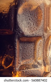 Part of beer mug with beer and ice, wet and cold, macro - Shutterstock ID 560887402