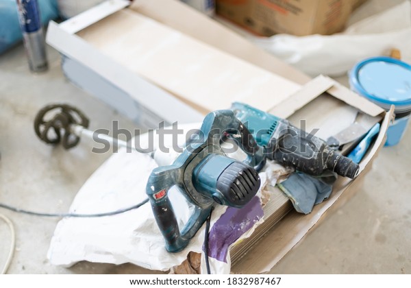the part of car high pressure pump and the\
tool for repair on white\
background