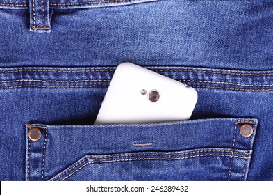 Part of cellphone in blue jeans back pocket