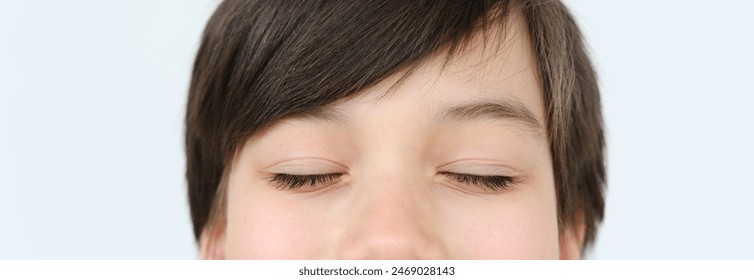 part child face, boy 10 years old, human eyes closed, concept surveillance, vision examination, diagnosis, treatment ophthalmic diseases, eyelids, emotional development children - Powered by Shutterstock