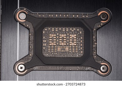 Part of the circuit board with a graphics processor attachment position of a graphics card, view close-up through a hole in the casing, top view close-up, background, texture  