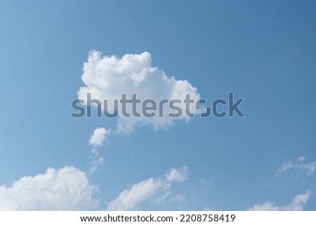 Part of the cloud separates in close up, airy clouds