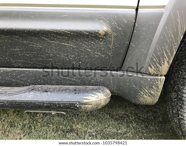Part of dirty car\
after drive on mud road