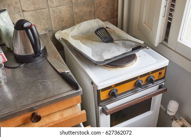 Part Of A Dirty, Messy Kitchen With Stove