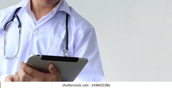 A Part Of Doctor Body Who Wearing Stethoscope And Holding Ipad 